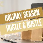 This is an image of an open laptop computer with shopping bags and twinkle lights for the Holiday Season Hustle and Bustle blog post.