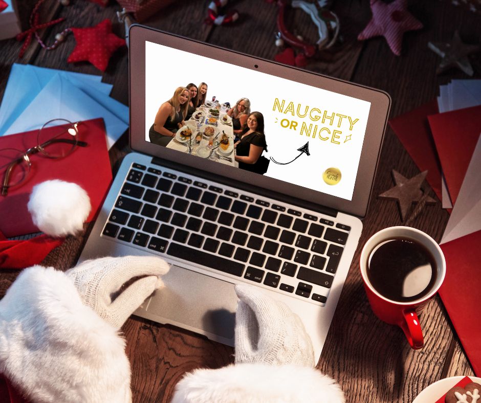 SAnta is at his computer during the hustle and bustle of the holiday season, as he checks off nice for the Simply Sunni team.