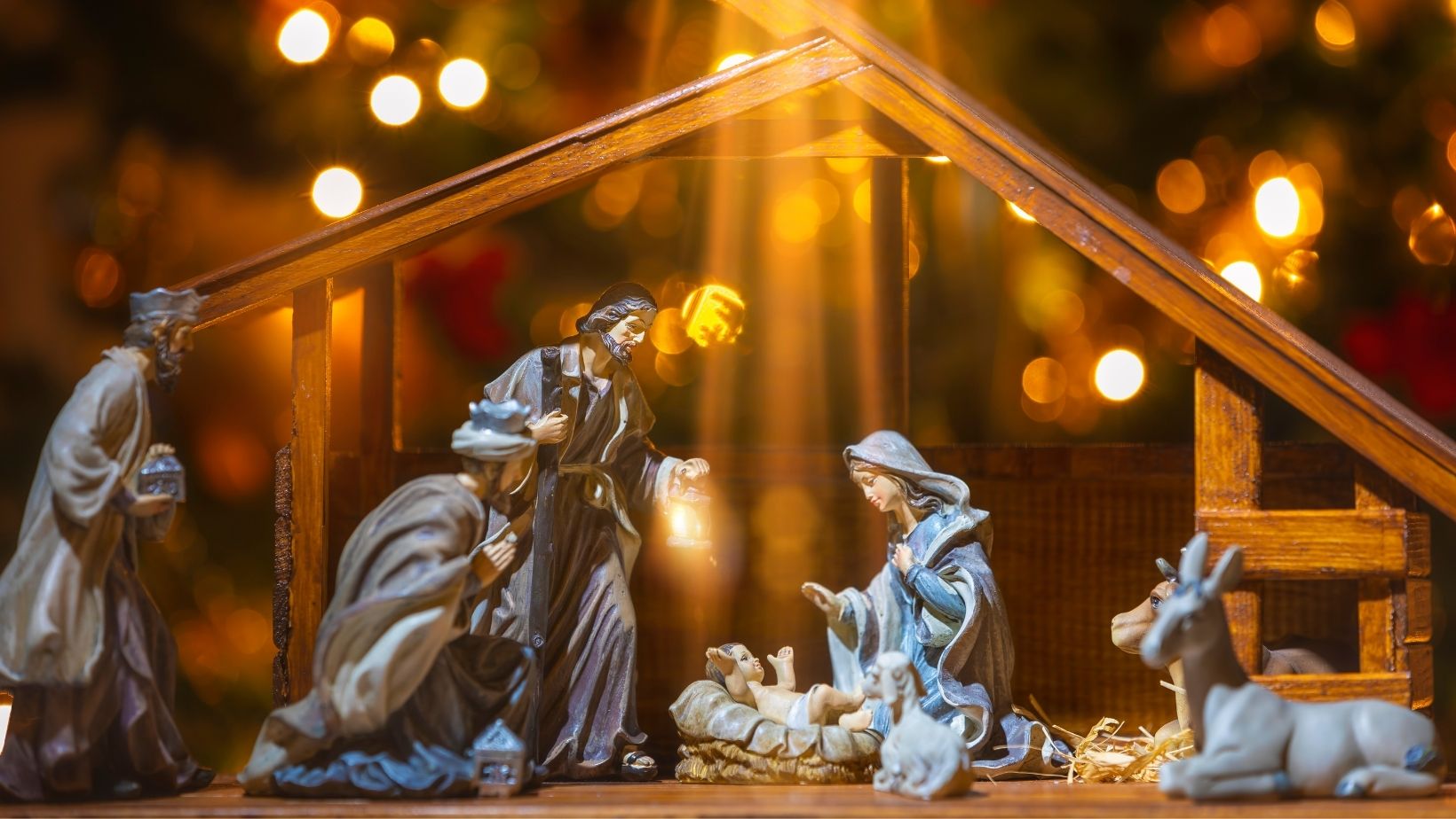 A golden filtered image of a nativity scene for Christmas.