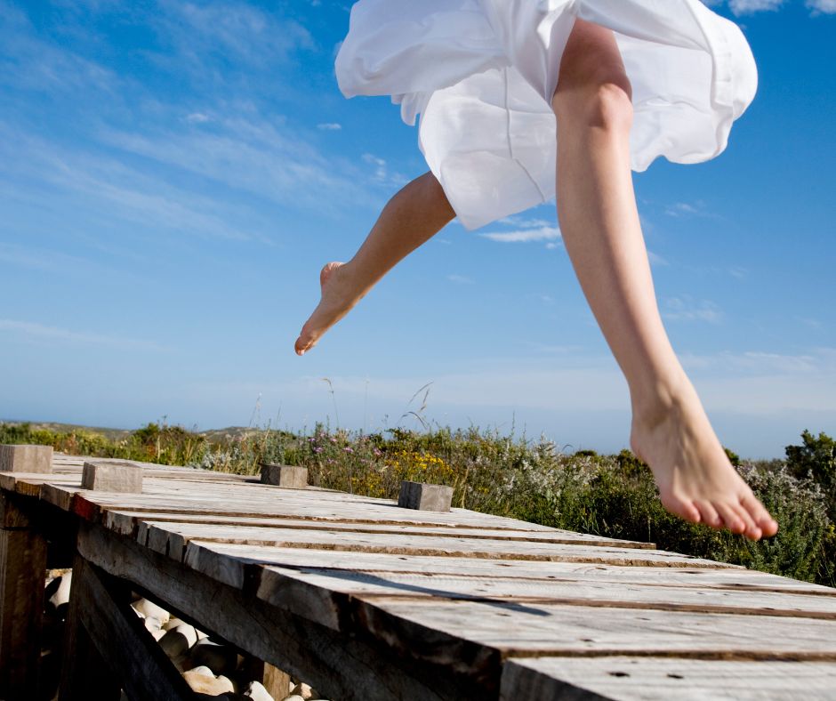 Taking a leap of faith on a dock are these feet at the beach!
