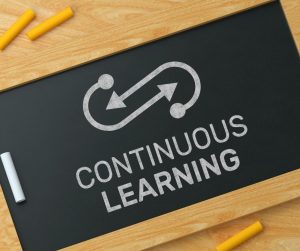 Image for continuous learning with a chalkboard, ideal for women-owned businesses.