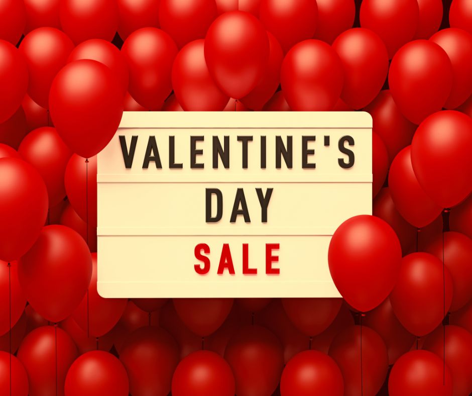 A red balloon filled area with a market sign saying Valentine's Day SALE.