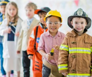 Children in professional costumes for career day ideas.