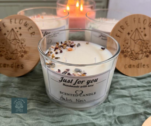 Jar candle with a wood lid by Fire Flower Candles.