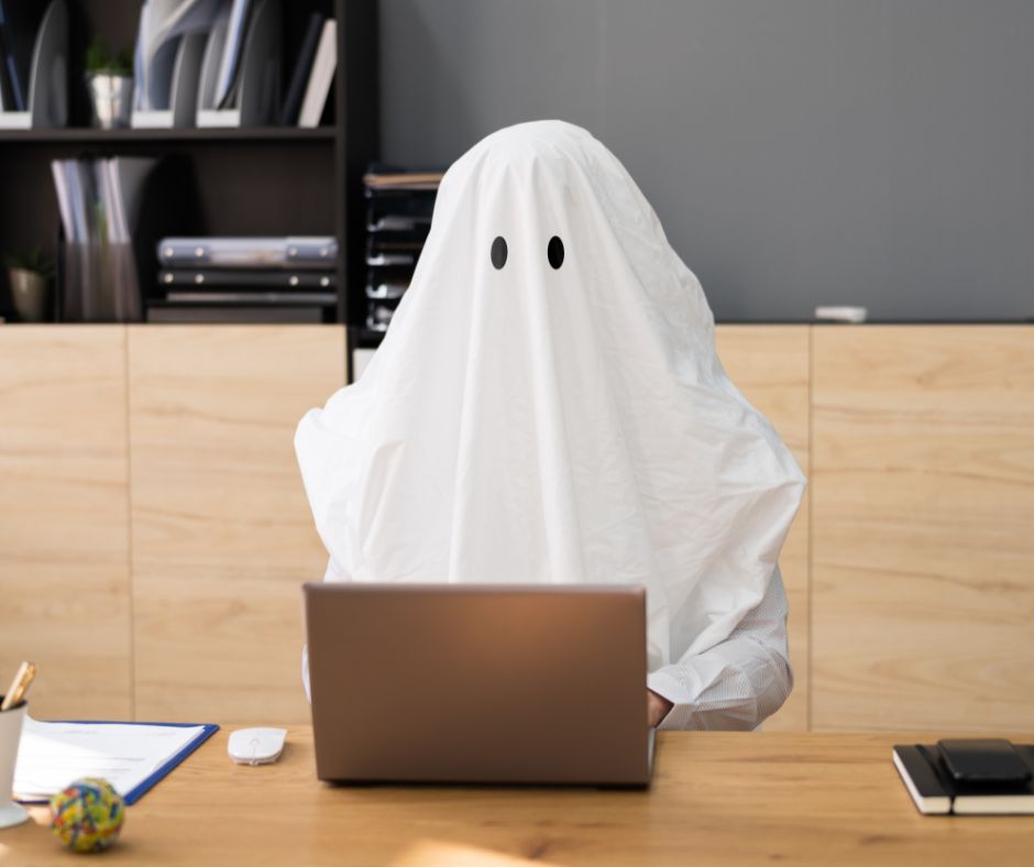 This is a funny image of a ghostwriting ghost sitting at a desk.