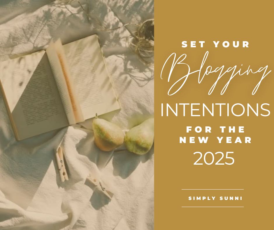 A picture of a picnic scene with a journal open to set blogging intentions for the New Year 2025.